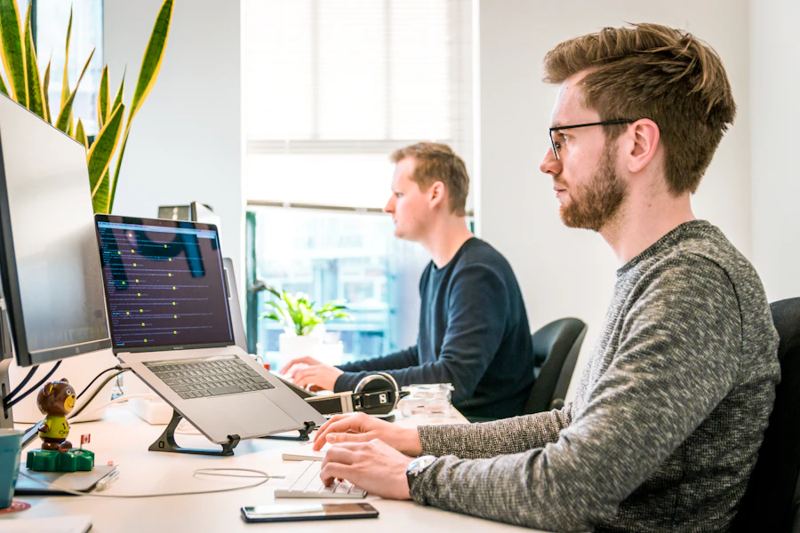 Revive Guard client reviewing website uptime and backup dashboard on a laptop
